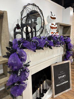 A whimsical Halloween mantle design featuring a custom designer mesh garland.
