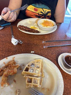 Chicken and waffle and eggs bacon and grits