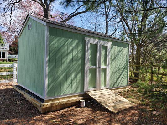 12x8x9 A frame with a wood ramp on a gravel pad