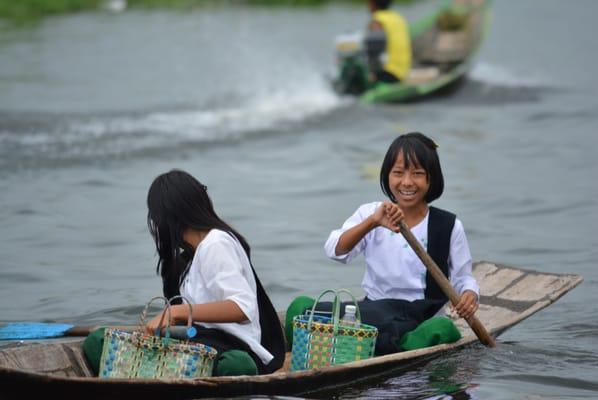 Kids rowing to school, Inle Lake- Myanmar.
