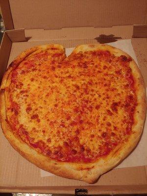 Heart shaped pizza. Valentine's Day..