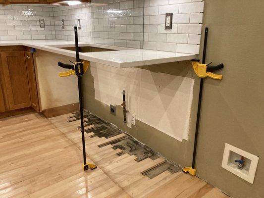 Successfully securing a quartz countertop in place, thus saving the client thousands of dollars.