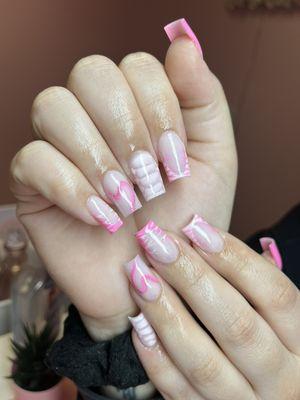 Small acrylic nail set with advanced nail art.