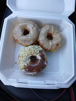 2 maple donuts and chocolate with peanuts