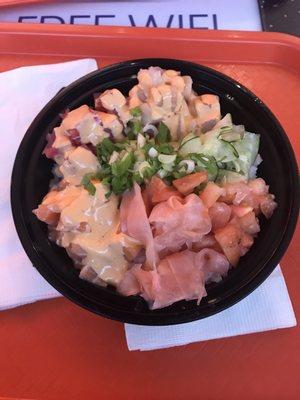 Poke bowl with tuna, salmon, yellowtail, and topped with Sriracha mayo!