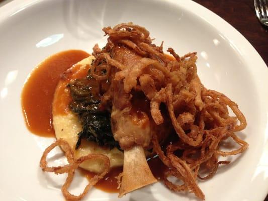 Braised Pork Shank with Braised Greens over Cheddar Grits.