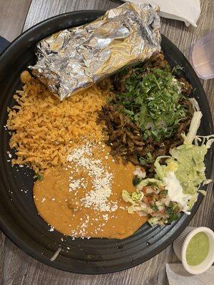 Al pastor with corn tortillas rice and beans