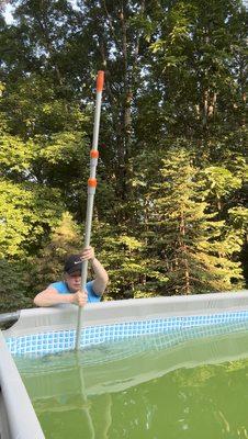 Scrubbing the algae off the walls for algae be gone treatment!