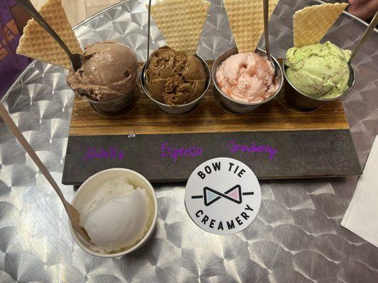 Icee cream flight plus one.  From left to right: Nutella gelato, espresso, strawberry and waffles, mint chocolate  Cup: Pima colada sorbet
