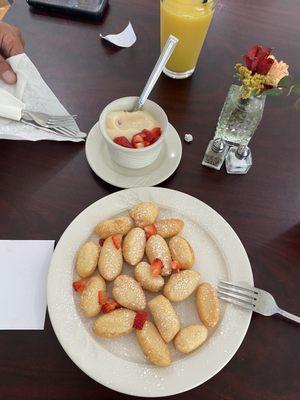 Another picture of the beignets. The strawberries make it a perfect bite because it cuts through the sweetness.