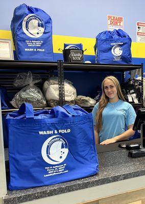 Our wash dry fold attendant area. Showing the free bag customers receive with their first wash dry fold order.