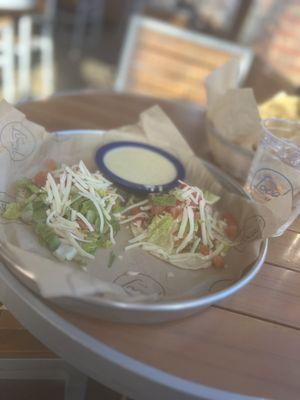 Chicken tacos / one fried, the other with verde sauce