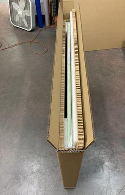 Custom packaging for a fragile painting. Done with extra care.