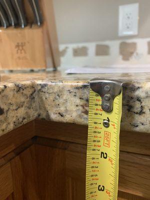 FINISHED product- one month later, different thickness in pieces seamed up to each other causing gap on left side where it meets the cabinet