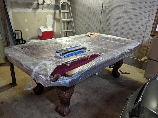 pool table pocket crushed and huge scratches down sides . Wrapped in plastic????