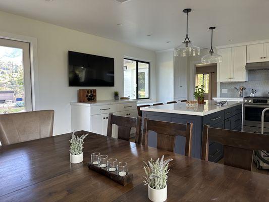 Transitional kitchen with island an entertainment center