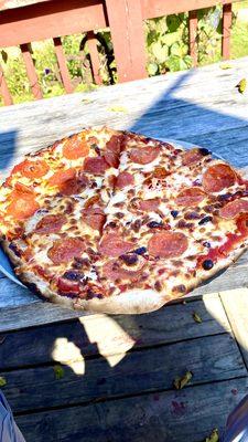 Pepperoni and sun dried tomato pizza