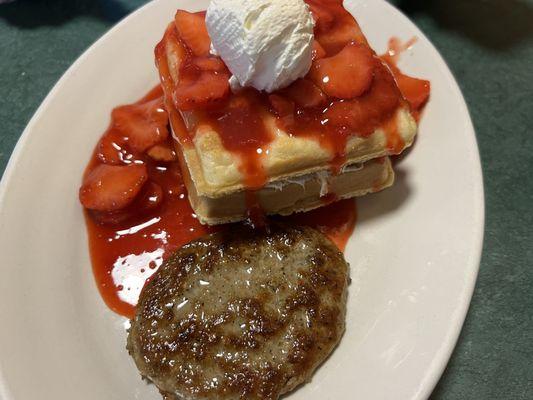 Stuffed Strawberry Waffle with Sausage ($18.95) with a glass of fresh Tetzners Milk ($3.95)