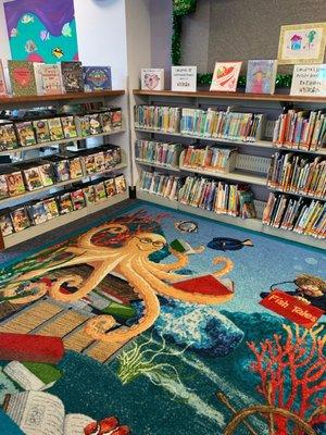 Cute children's corner with fun rug