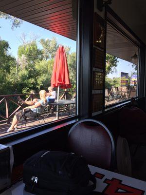 View of the patio overlooking the tranquil stream and course