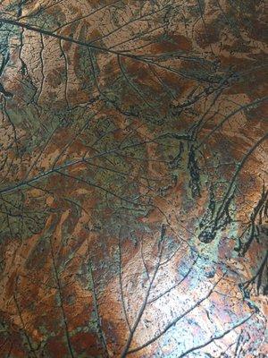 Cool bronze-like tabletop, like Autumn.