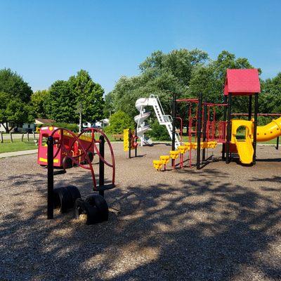 smaller pieces surround the central playground equipment