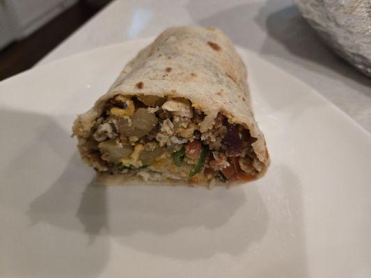 Eggs, bacon, potatoe, cheese, pico.