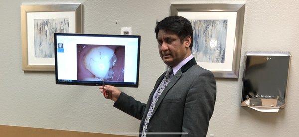 Dr. Sharma, Explaining intra oral findings to patient.