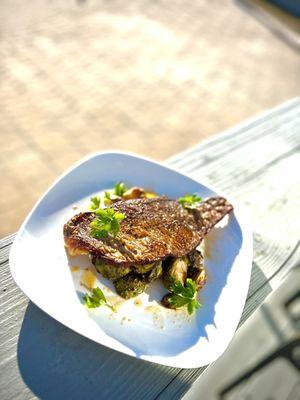 new crispy trout with sautéed brussel sprouts come give it a try awesome with a glass of wine