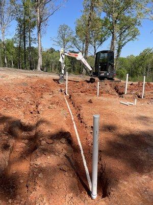 Roughing in plumbing before pouring concrete slab
