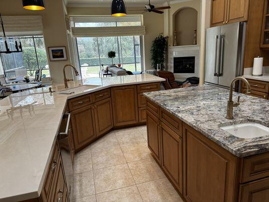 Wrap it in porcelain they say, you got it! Highlighted island and full height splash. Fireplace and dining table to match