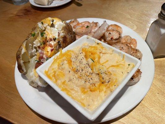 Grilled shrimp, loaded baked potato and cheesy grits