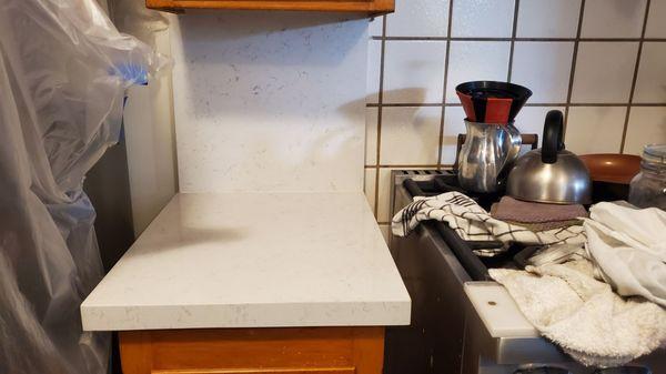 Tile behind the stove was left untouched on customers requested