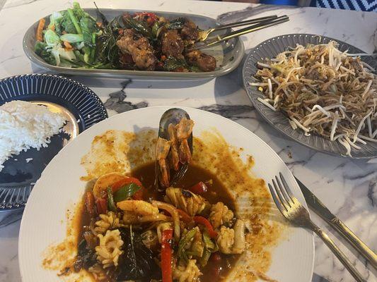 Mix seafood dish in front (can't recall the name of the dish), crispy duck in back, and pad Thai on the right.
