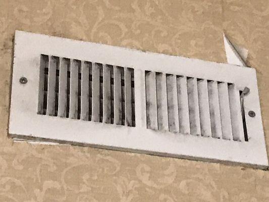 Wallpaper peeling and a much needed air vent that needs cleaning
