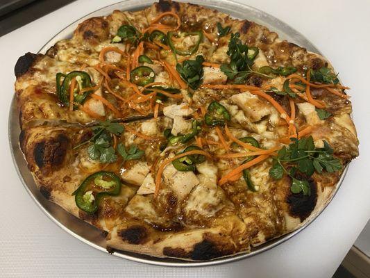 Thai Chicken Pizza- house made peanut sauce, fresh roasted chicken, picked carrots and jalapeños, fresh cilantro try, sweet chili sauce