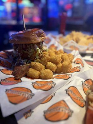 Hamburger with bacon and side of tots