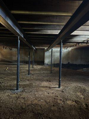 Installed dual support beams and new posts, replacing the old rotted out and wavy wood beam.