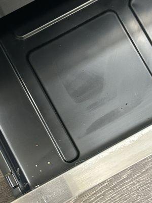 dirt inside of stove warming tray