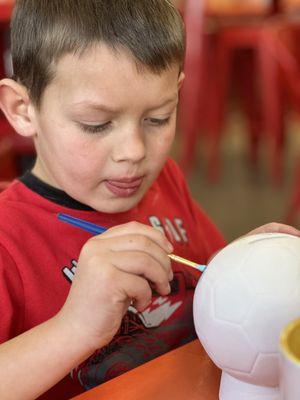 Focusing really hard while painting.