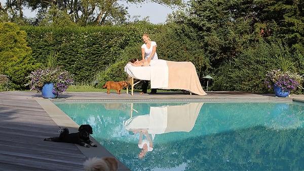 A lovey way to relax in the Hamptons with dogs and a massage by the pool!
