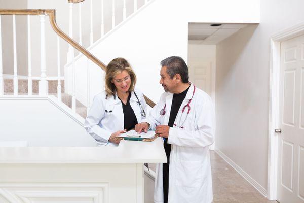 FNP Sue Brundrett left, Dr. Pedro Castro right