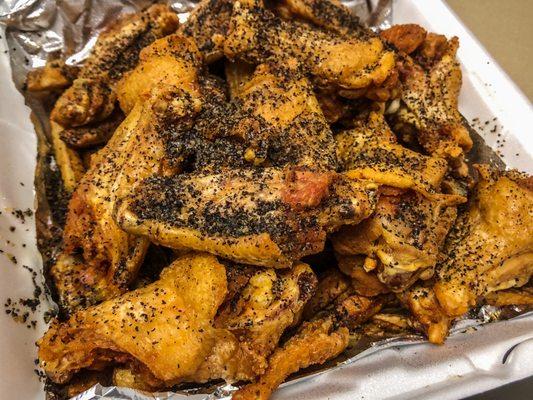 Salt and Pepper Wings on a bed of fries