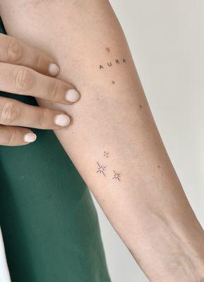 Single needle minimalist tattoo set on the arm- fine line stars and micro lettering- done at B36 Tattoo Studio, Los Angeles