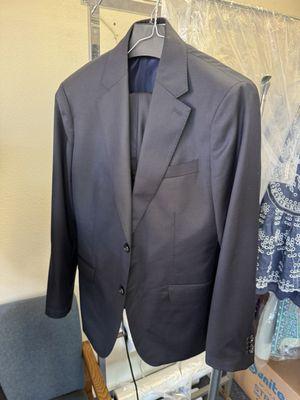 Tailored suit and hemmed pants