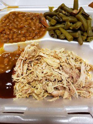 Pulled chicken, green beans, and baked beans. Sweet BBQ sauce on the side.