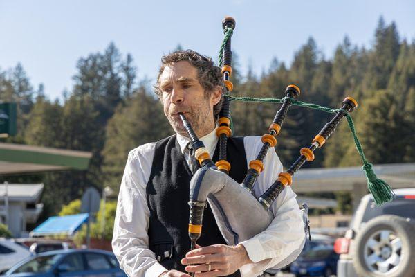 A bagpiper plays music at Boulder Creek Costume Outfitters grand opening.