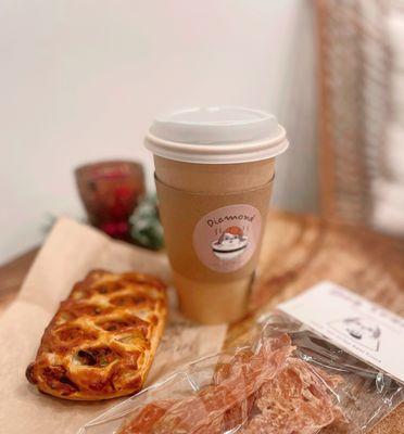 Americano; Tomato and Olive Pastry; Chicken Treats (for dogs).