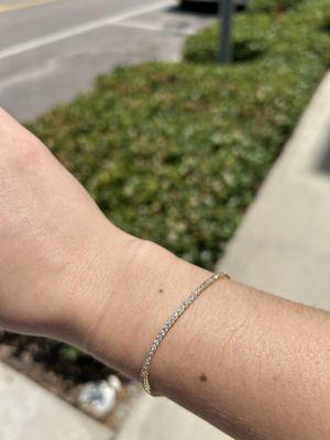 Diamond tennis bracelet catching the light