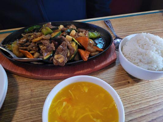 Sizzling beef and scallops white rice and egg flower soup.